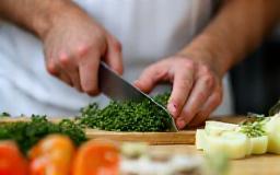 Chef carefully preparing ingredients by hand